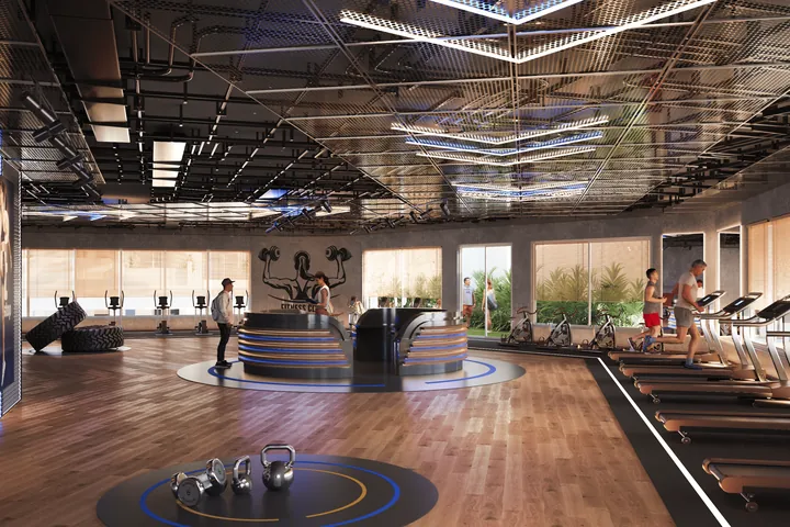 The gym, with rows of equipment beneath a feature ceiling